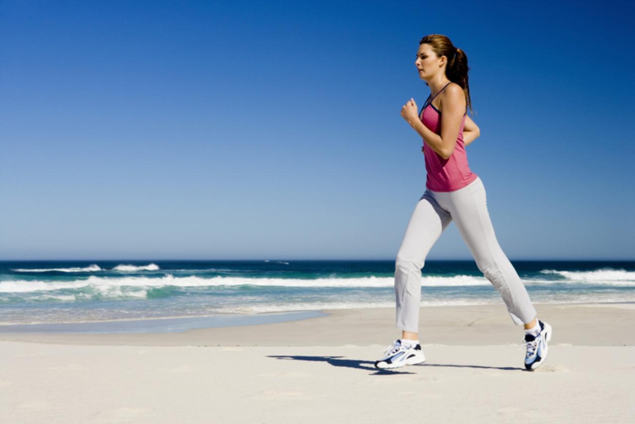 'Woman running on beach'