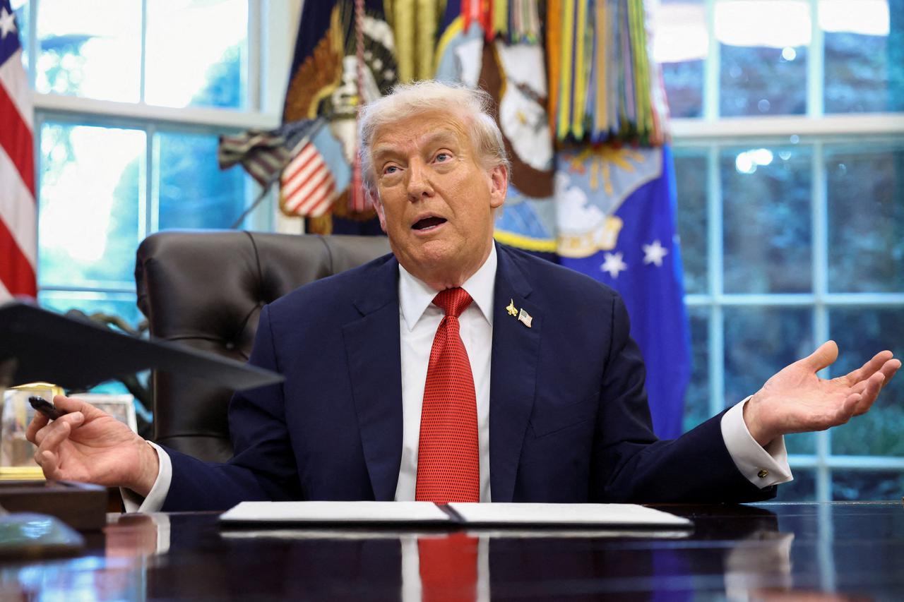 U.S. President Donald Trump signs executives orders at the White House in Washington, D.C.
