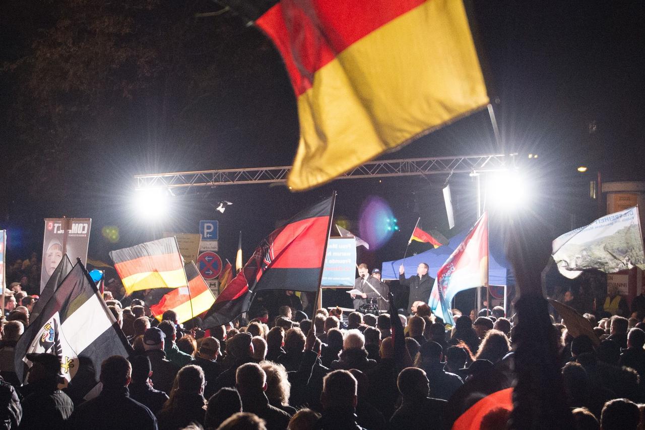 Participants in an 'Alternative for Germany' (AfD) rally wave their flags in Erfurt, Germany, 18 November 2015. This was to be the last Thuringian AfD rally for this year. Photo:?SEBASTIAN?KAHNERT/dpa/DPA/PIXSELL