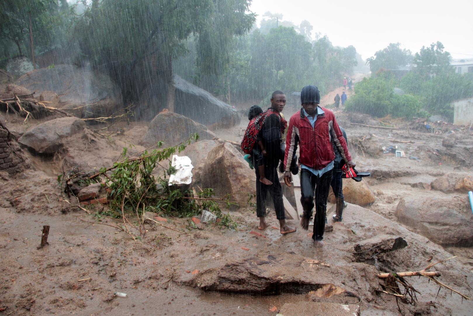 Residents survey the damage caused by Cyclone Freddy in Chilobwe, Blantyre, Malawi, March 13, 2023. REUTERS/Eldson Chagara. Photo: Eldson Chagara/REUTERS