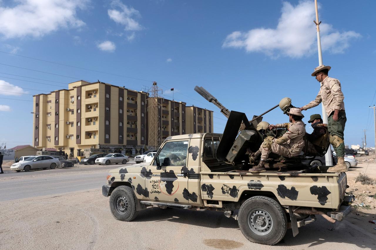Security forces stand guard outside the Parliament building in Tobruk, Libya