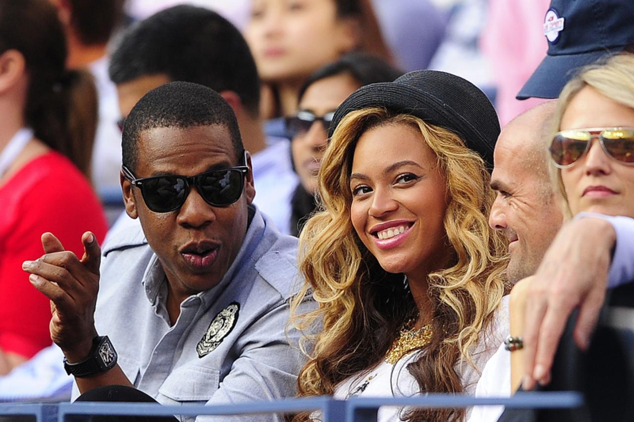 '(FILES) This September 12, 2011 file photo shows US singers Jay-Z and Beyonce watching Spanish tennis player Rafael Nadal play Serbia's Novak Djokovic in the men's US Open 2011 final at the USTA Bi
