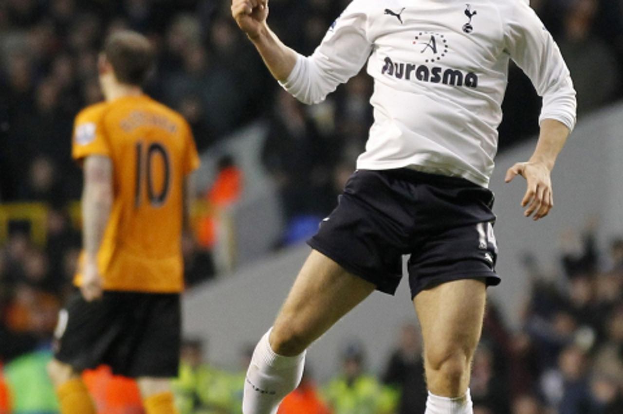 'Tottenham Hotspur\'s Croatian midfielder Luka Modric (R) celebrates scoring his goal during the English Premier League football match between Tottenham Hotspur and Wolverhampton Wanderers at White Ha