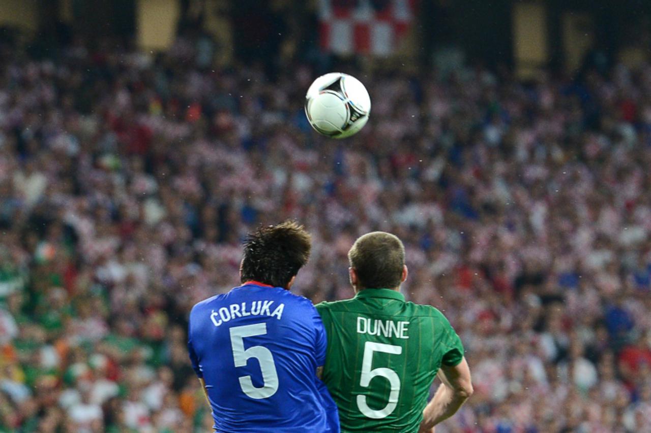 'TOPSHOTS - Irish defender Richard Dunne (R) vies with Croatian defender Vedran Corluka during the Euro 2012 championships football match Republic of Ireland vs Croatia on June 10, 2012 at the Municip