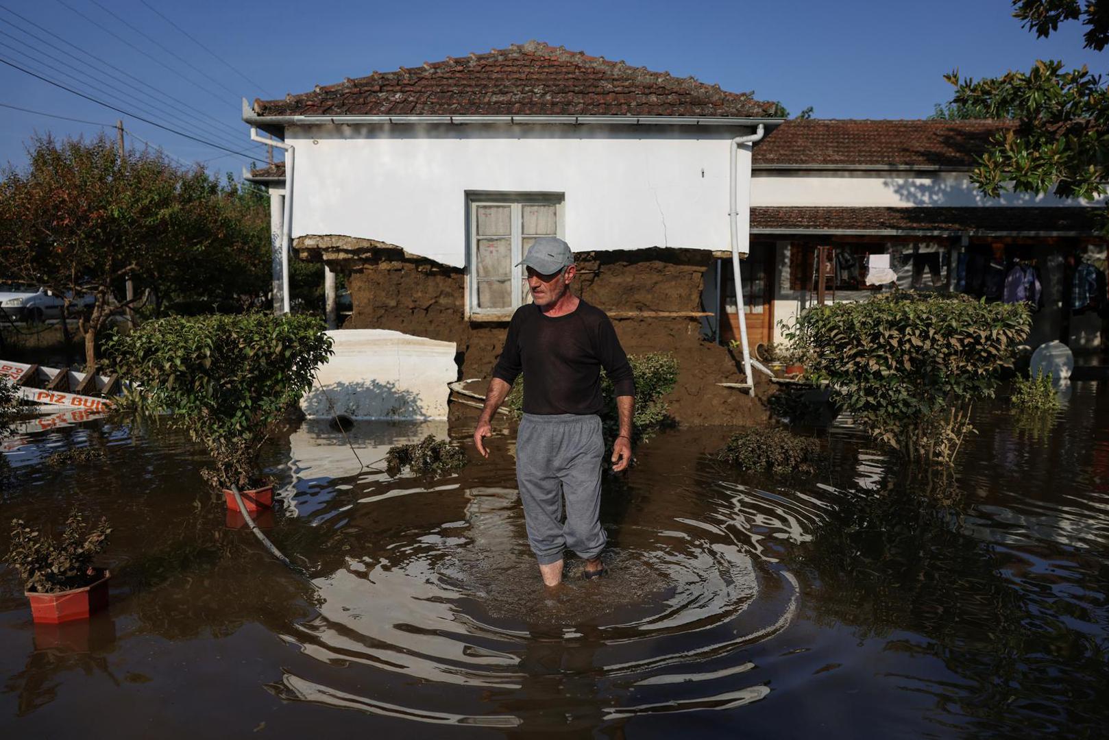 Dimos Tsiakas walks in the yard of his flooded house, in the aftermath of Storm Daniel in central Greece, in the village of Palamas, Greece, September 9, 2023. REUTERS/Alexandros Avramidis Photo: ALEXANDROS AVRAMIDIS/REUTERS