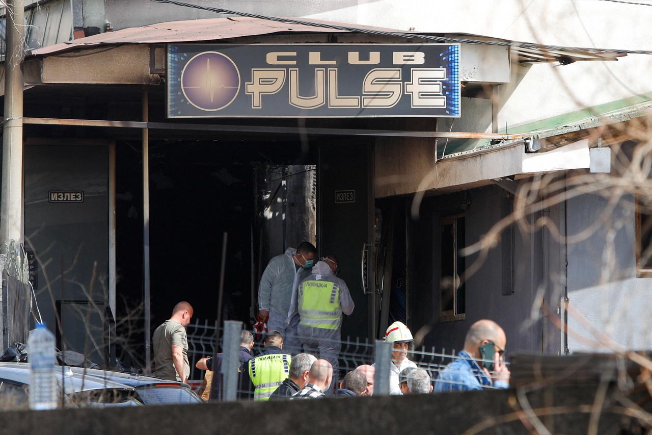 Rescue crews operate outside a night club, following a fire resulting in casualties, in the town of Kocani