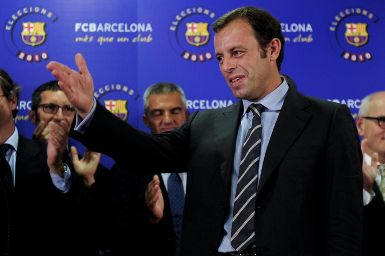 'Barcelona\'s former vice chairman, Sandro Rosell celebrates after winning an election to replace outgoing chaiman of Spanish and European champions Barcelona Joan Laporta, in Barcelona on June 14, 20