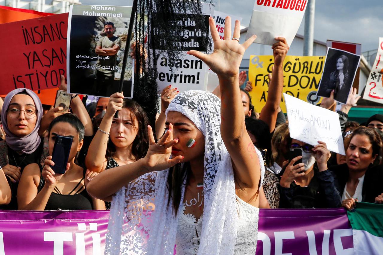 A protestor performs during a demonstration following the death of Mahsa Amini in Iran, in Istanbul