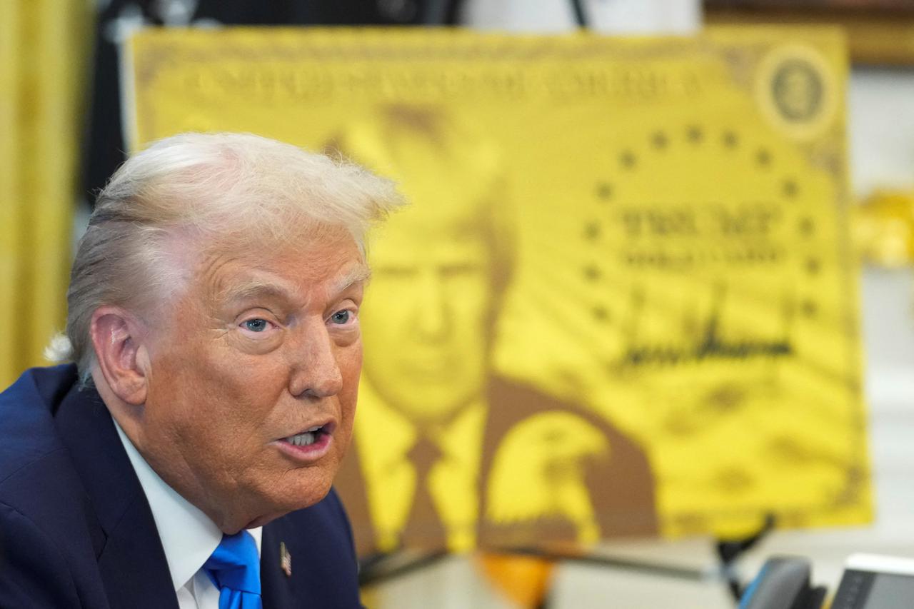 U.S. President Donald Trump signs executive orders in the Oval Office at the White House in Washington
