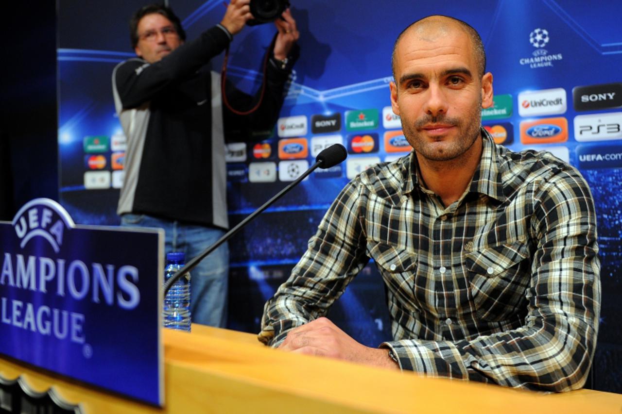 \'Barcelona\'s coach Josep Guardiola gives a press conference before a training session at the Camp Nou stadium in Barcelona on October 19, 2010 in Barcelona on the eve of their Champions League footb