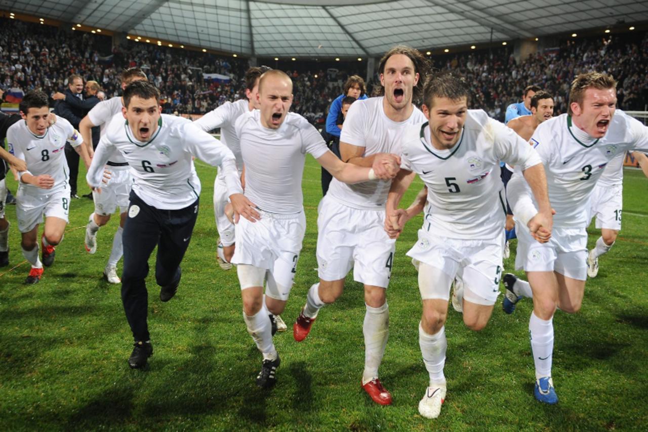 'Slovenia\'s team celebrate after their World Cup 2010 qualifying play-off second leg football match between Slovenia and Russia, in Maribor, some 150 kilometers from capital Ljubljana, on November 18