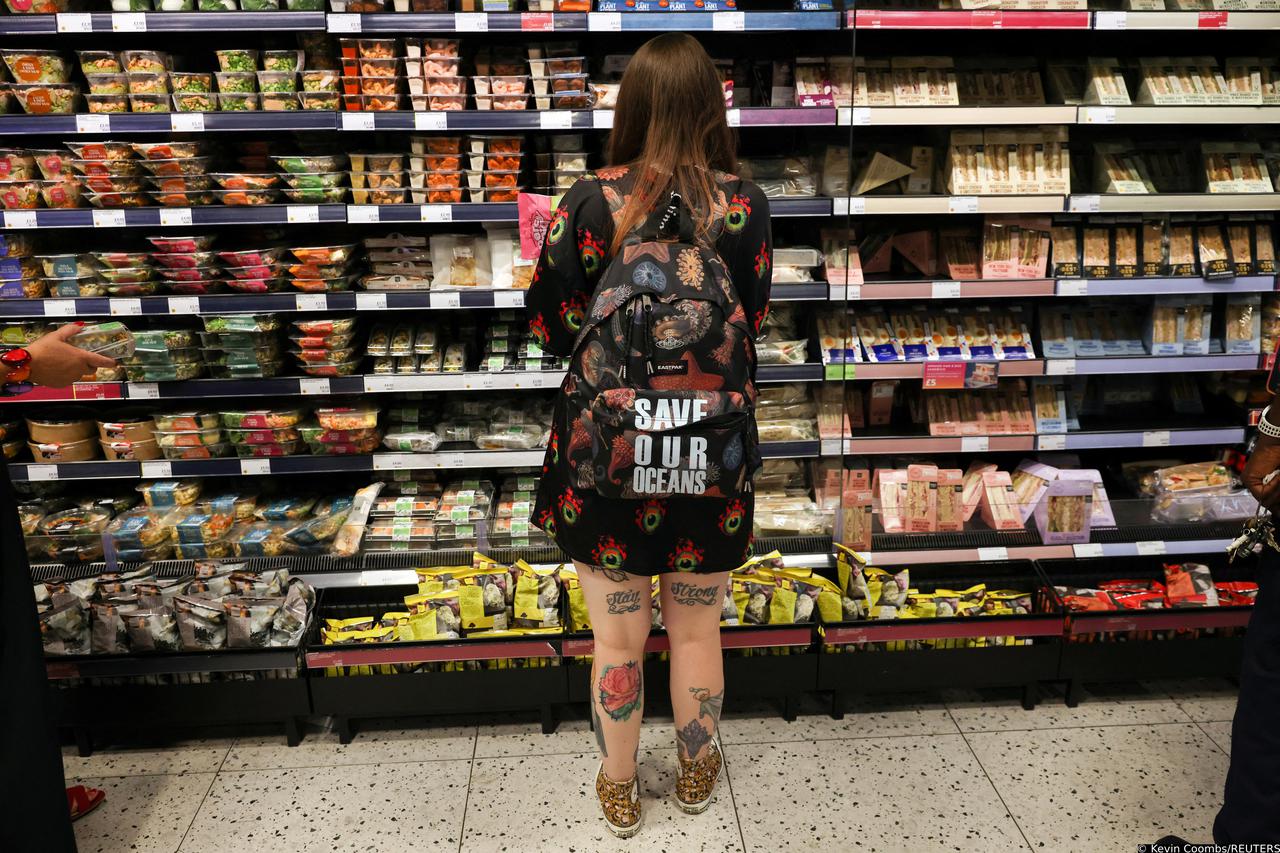 A person looks at food goods in a shop in London
