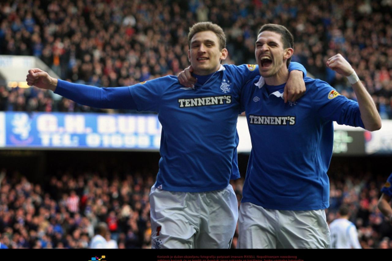 'Rangers Nikica Jelavic (right) celebrates his goal during the Clydesdale Bank Scottish Premier League match at Ibrox, Glasgow. Photo: Press Association/Pixsell'