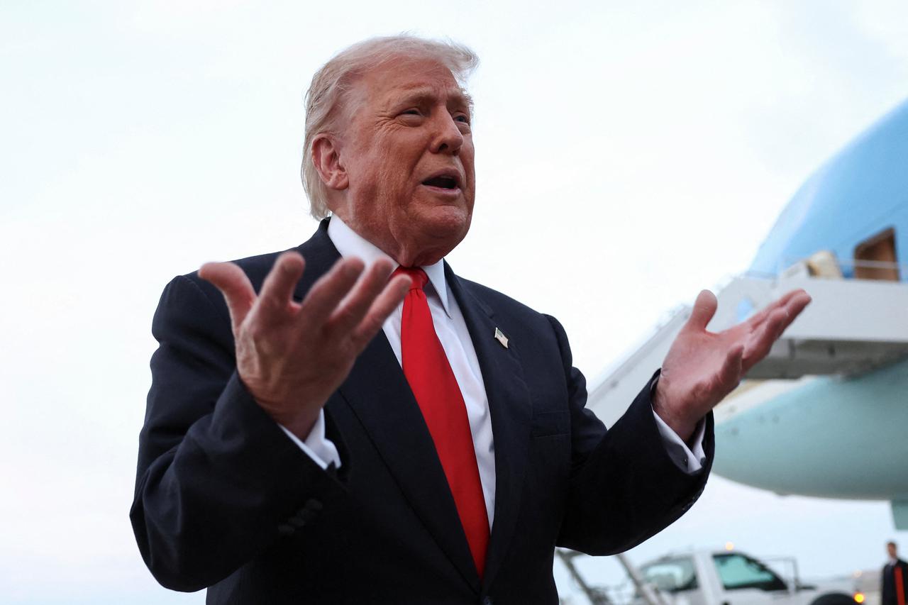 Trump speaks to reporters upon his return to Washington