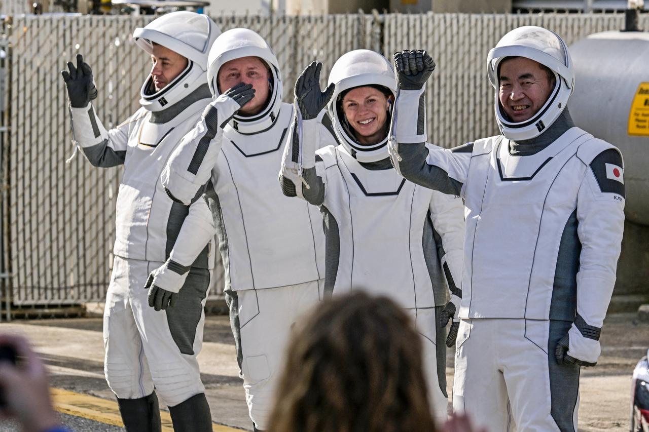 NASA's  SpaceX Crew-11 crew members walk out of the Operations & Checkout Building at the Kennedy Space Center for transport to Launch Complex 39-A, in Cape Canaveral
