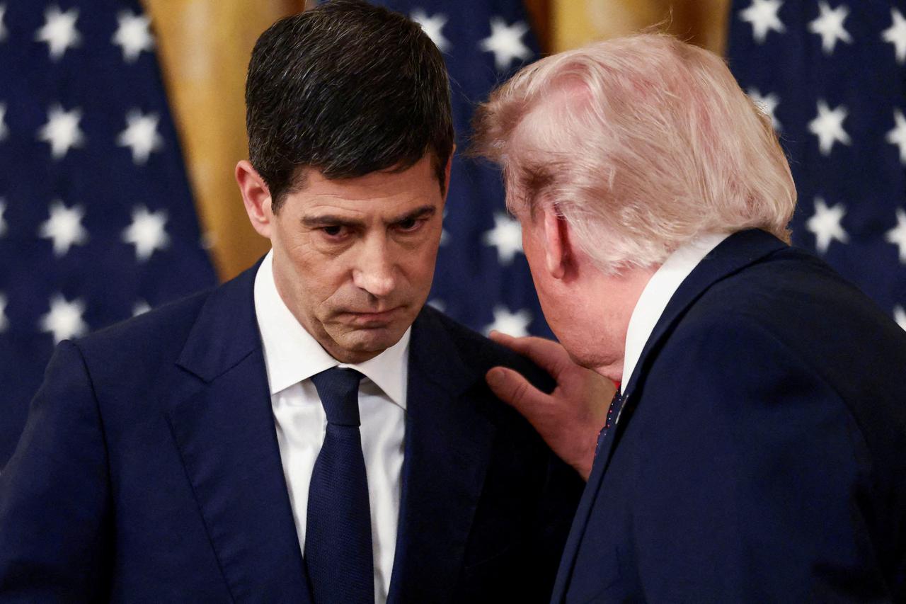 U.S. President Donald Trump speaks with the new Federal Reserve Chair Kevin Warsh