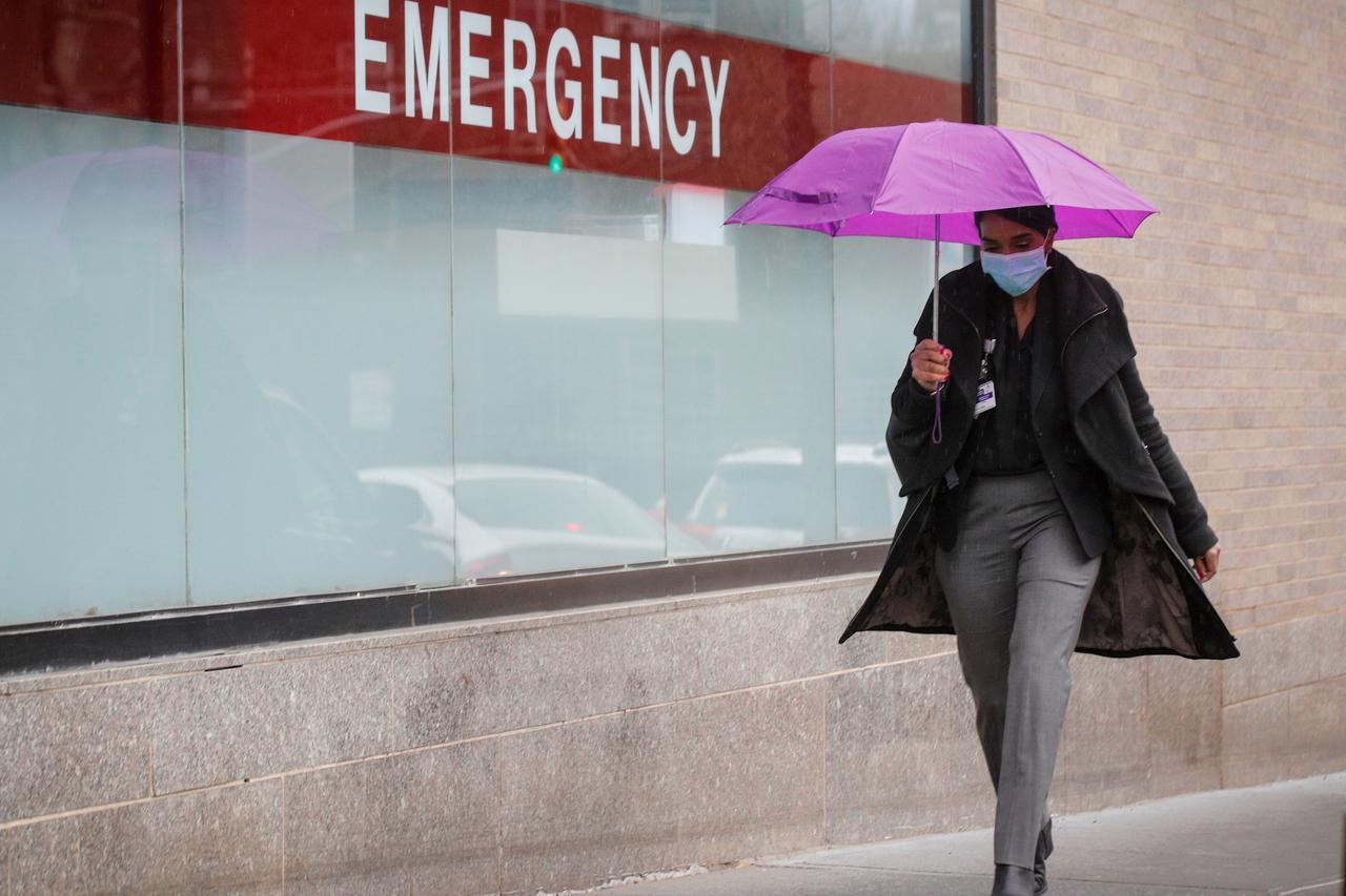 A Healthcare worker arrives at Mount Sinai Hospital, during the outbreak coronavirus disease (COVID-19)  outbreak, in New York