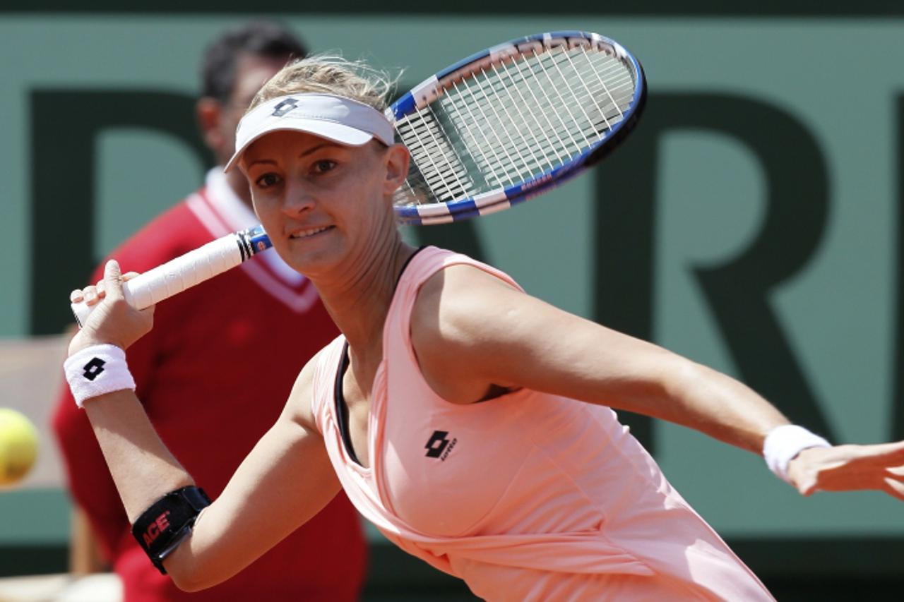 'Croatia\'s Mirjana Lucic returns the ball to Russia\'s Maria Sharapova during their Women\'s first round match in the French Open tennis championship at the Roland Garros stadium, on May 24, 2011, in