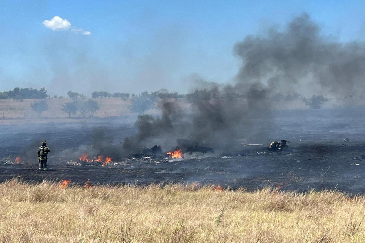 Emergency personnel respond to the scene of a military helicopter crash near Salado