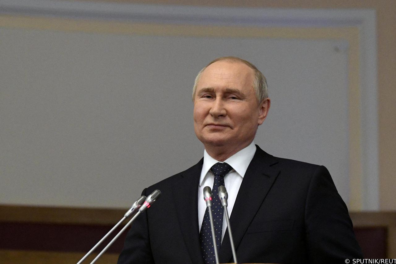 Russian President Vladimir Putin delivers a speech during a meeting of the Council of Legislators at the Federal Assembly in Saint Petersburg