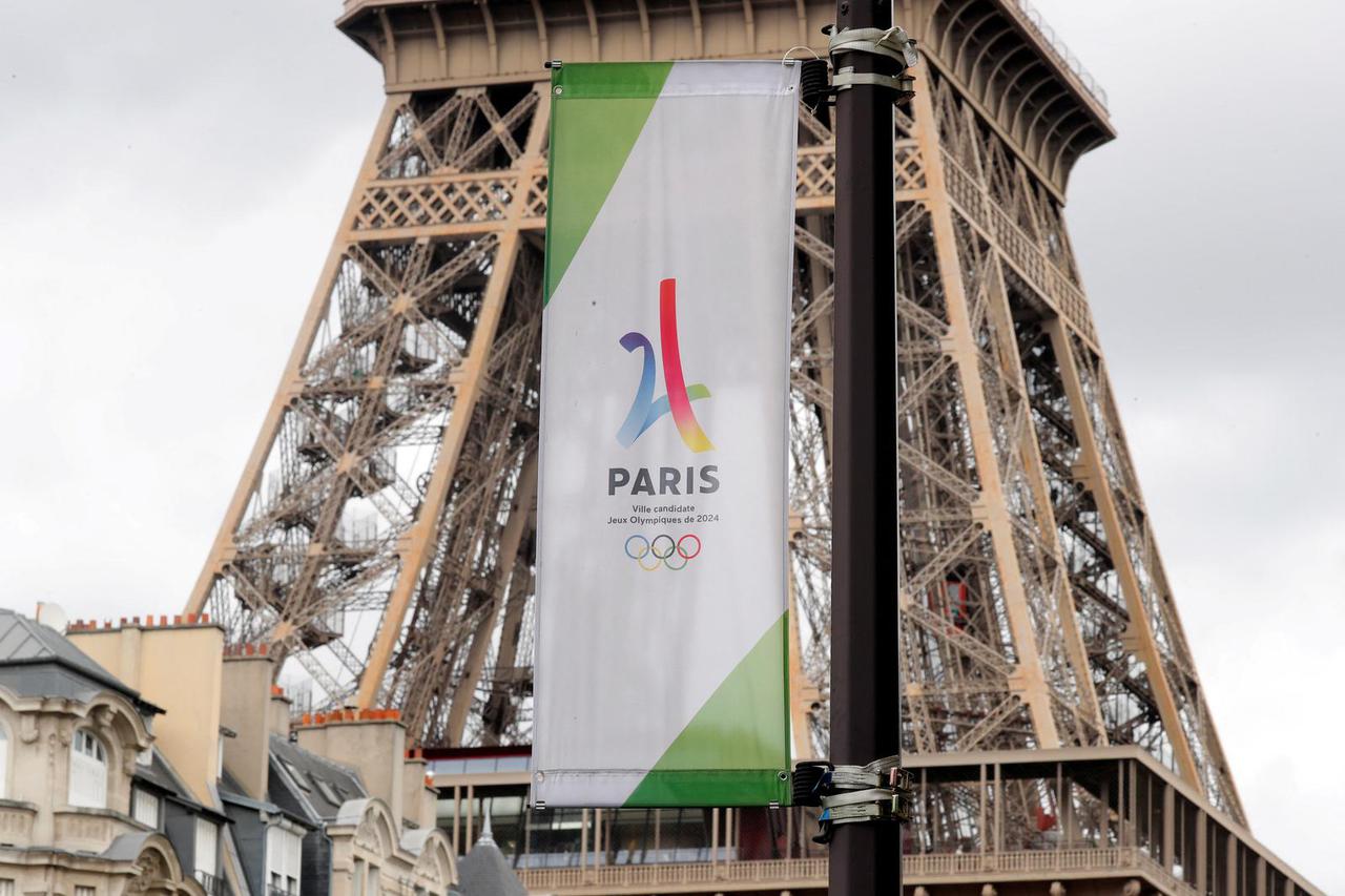 FILE PHOTO: The logo of the Paris candidacy for the 2024 Olympic and Paralympic Games is seen in front the Eiffel tower in Paris