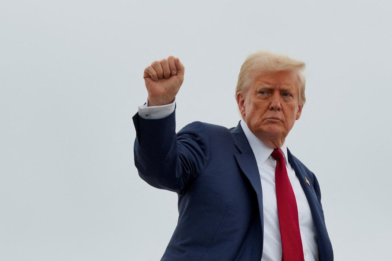 U.S. President Donald Trump boards Air Force One as he departs for New Jersey