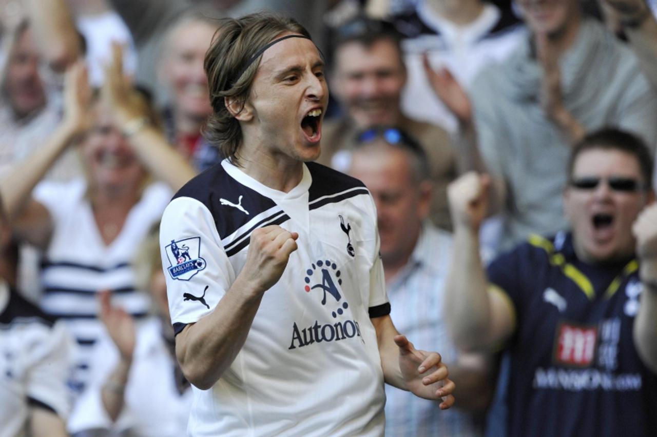 'Tottenham Hotspur\'s Luca Modric celebrates after scoring his team\'s second goal against Stoke City during their English Premier League soccer match at White Hart Lane in London April 9, 2011.    RE