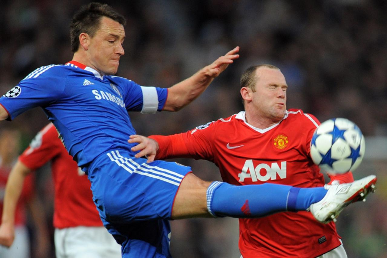 'Chelsea\'s English defender John Terry (L) and Manchester United\'s English forward Wayne Rooney compete during their UEFA Champions League quarter final second leg football match at Old Trafford in 