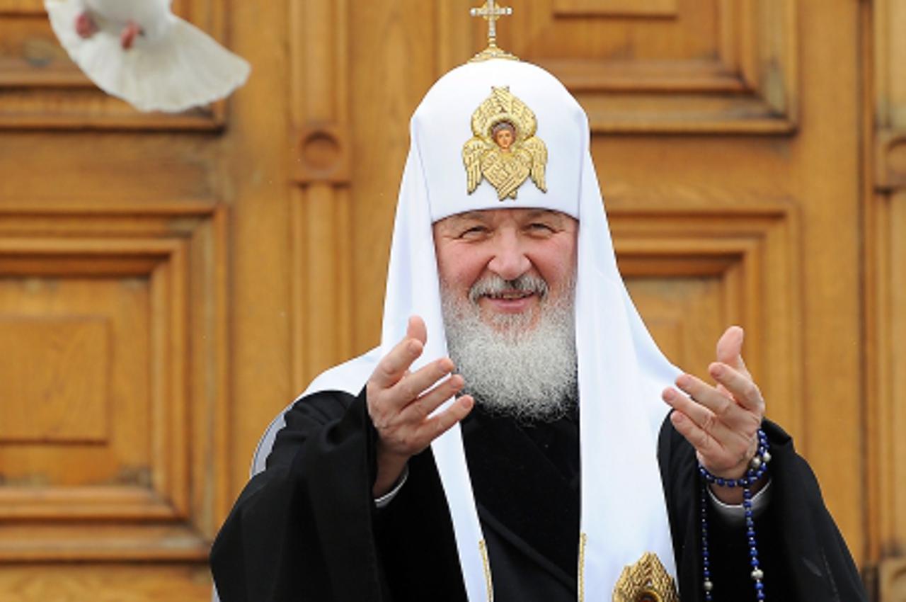 'Russian Orthodox Patriarch Kirill releases white doves to mark Annunciation Day in the Kremlin in Moscow, on April 7, 2011. In Christianity, Annunciation celebrates the relevation to the Virgin Mary 