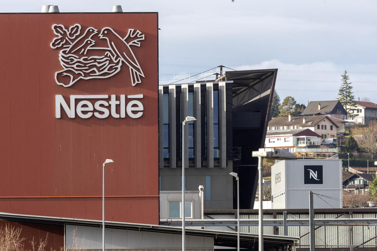 FILE PHOTO: A logo of food giant Nestle is seen in a building in Orbe
