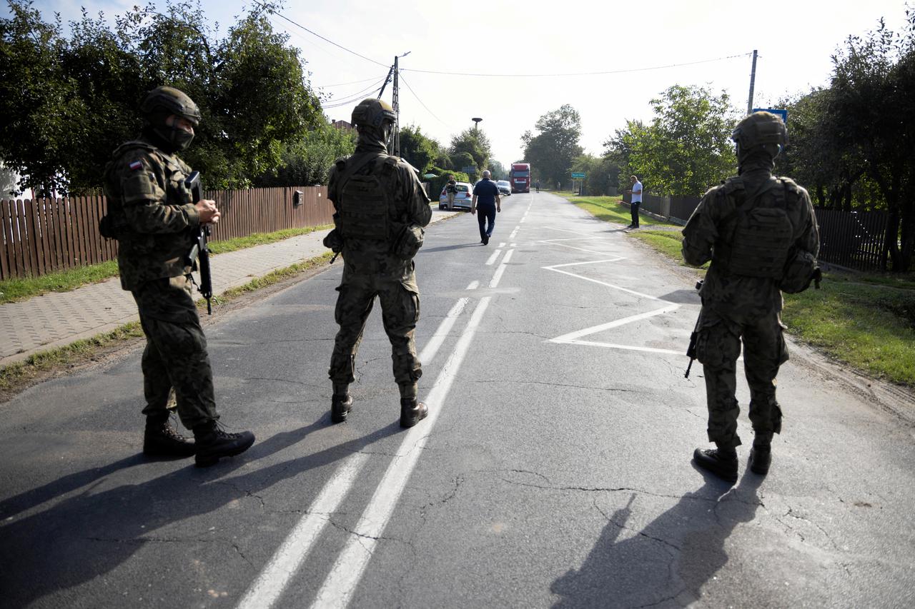 Soldiers patrol the street, following violations of Polish airspace during a Russian attack on Ukraine, in Wyryki