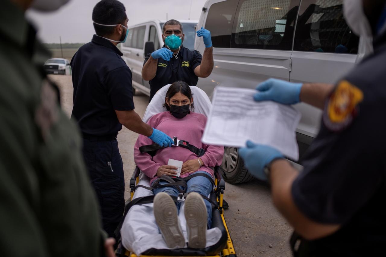 FILE PHOTO: Pregnant migrant woman is prepared for transport to hospital after crossing Rio Grande river into the U.S. from Mexico in Penitas, Texas