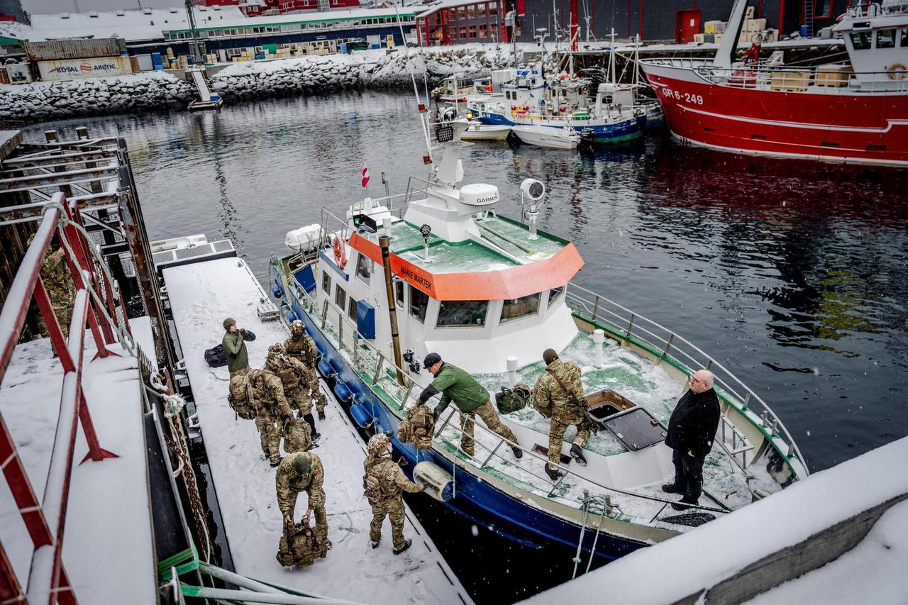 Danish soldiers disembark at the harbor in Nuuk