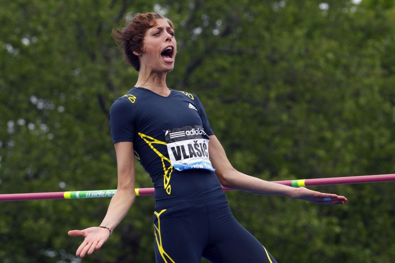 'Blanka Vlasic of Croatia celebrates clearing the bar at 1.91 meters on her way to winning the women's high jump   at the Diamond League Adidas Grand Prix in New York, May 25, 2013. REUTERS/Gary Hers