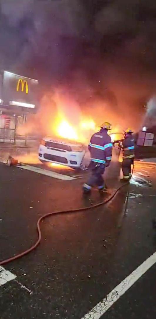 Police vehicle burns during protests after police shooting death of Wallace Jr. in Philadelphia, Pennsylvania Firefighters hose down a burning police vehicle during protests after the death of Walter Wallace Jr., a Black man who was shot by police in Philadelphia, Pennsylvania, U.S., October 27, 2020 in this still image taken from social media video. Instagram @reef_gotcars_58 via REUTERS  THIS IMAGE HAS BEEN SUPPLIED BY A THIRD PARTY. NO RESALES. NO ARCHIVES. MANDATORY CREDIT @REEF_GOTCARS_58
