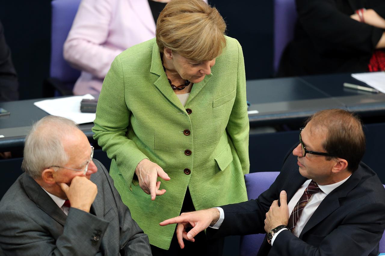 German Minister of Finance Wolfgang Schaeuble (CDU, L-R), German Chancellor Angela Merkel (CDU) and German Minister of Transport Alexander Dobrindt (CSU)talk during a debate at the Bundestag in Berlin, Germany, 24 June 2014. Photo: WOLFGANG KUMM/DPA/DPA/P