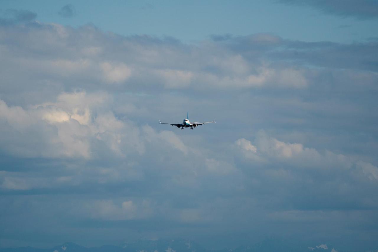 A Boeing jet intended for use by a Chinese airline returns to Boeing Field, in Seattle, Washington