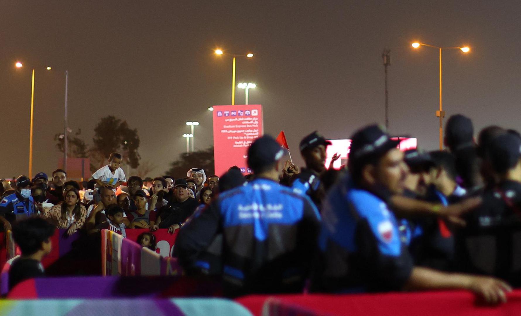 Soccer Football - FIFA World Cup Qatar 2022 - Group A - Qatar v Ecuador - FIFA Fan Festival - Al Bidda Park, Doha, Qatar - November 20, 2022 Police officers are seen as fans watch the opening ceremony REUTERS/Hannah Mckay Photo: HANNAH MCKAY/REUTERS