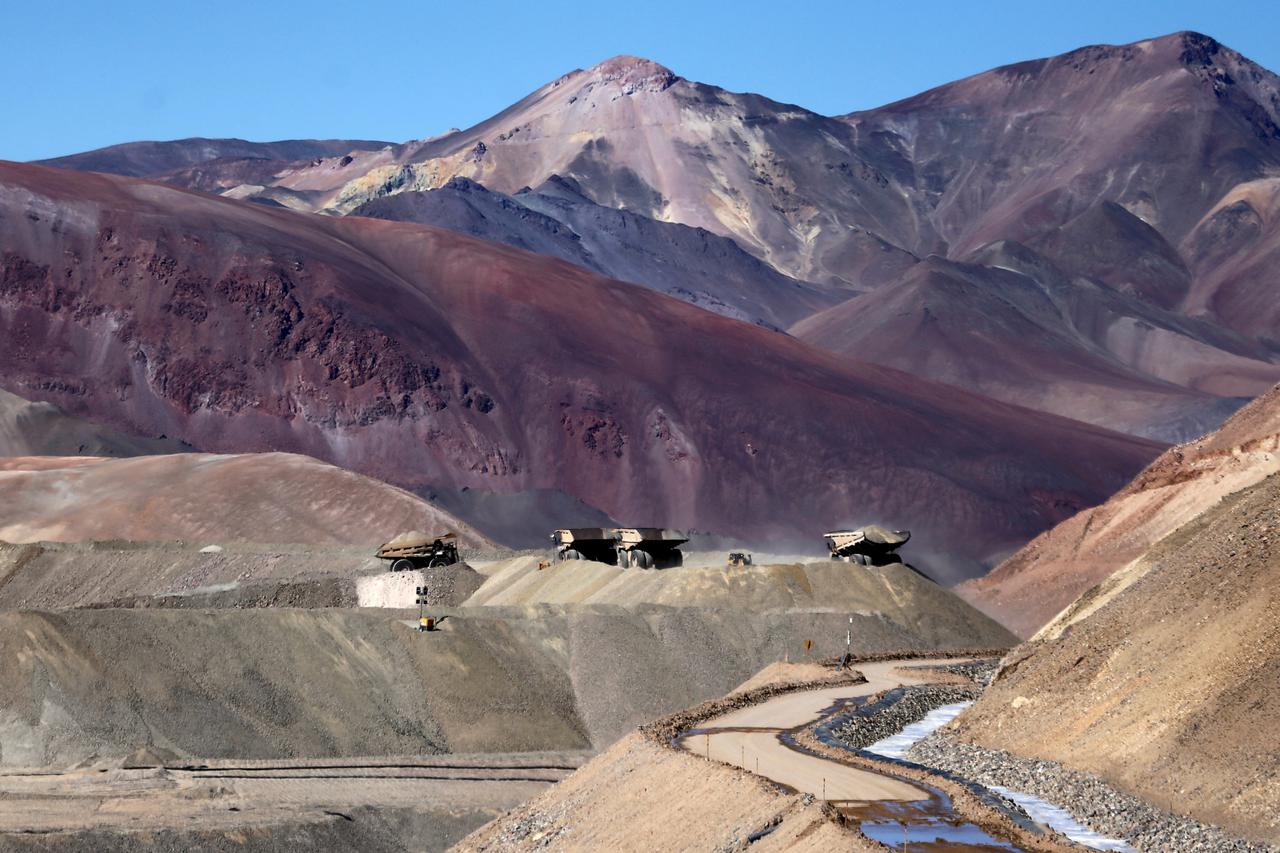 FILE PHOTO: Dump trucks operate at Barrick Gold Corp's Veladero gold mine in Argentina's San Juan province