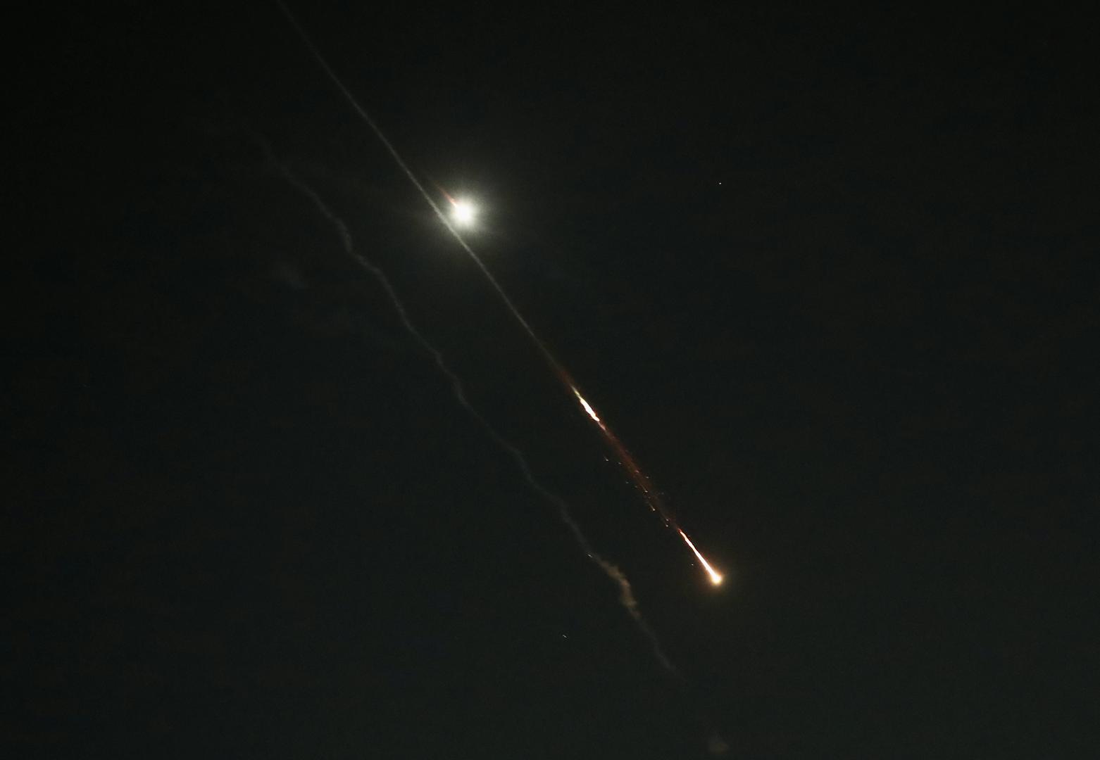 (240414) -- JERUSALEM, April 14, 2024 (Xinhua) -- This photo taken on April 14, 2024 shows flares from explosions in the sky over Jerusalem as Israel's Iron Dome anti-missile system intercepts missiles and drones from Iran. A combined attack of dozens of ballistic missiles and hundreds of drones from Iran triggered air raid alerts across Israel early on Sunday, the Israeli army said, as residents reported multiple bombings were heard. (Photo by Jamal Awad/Xinhua) Photo: Jamal Awad/XINHUA