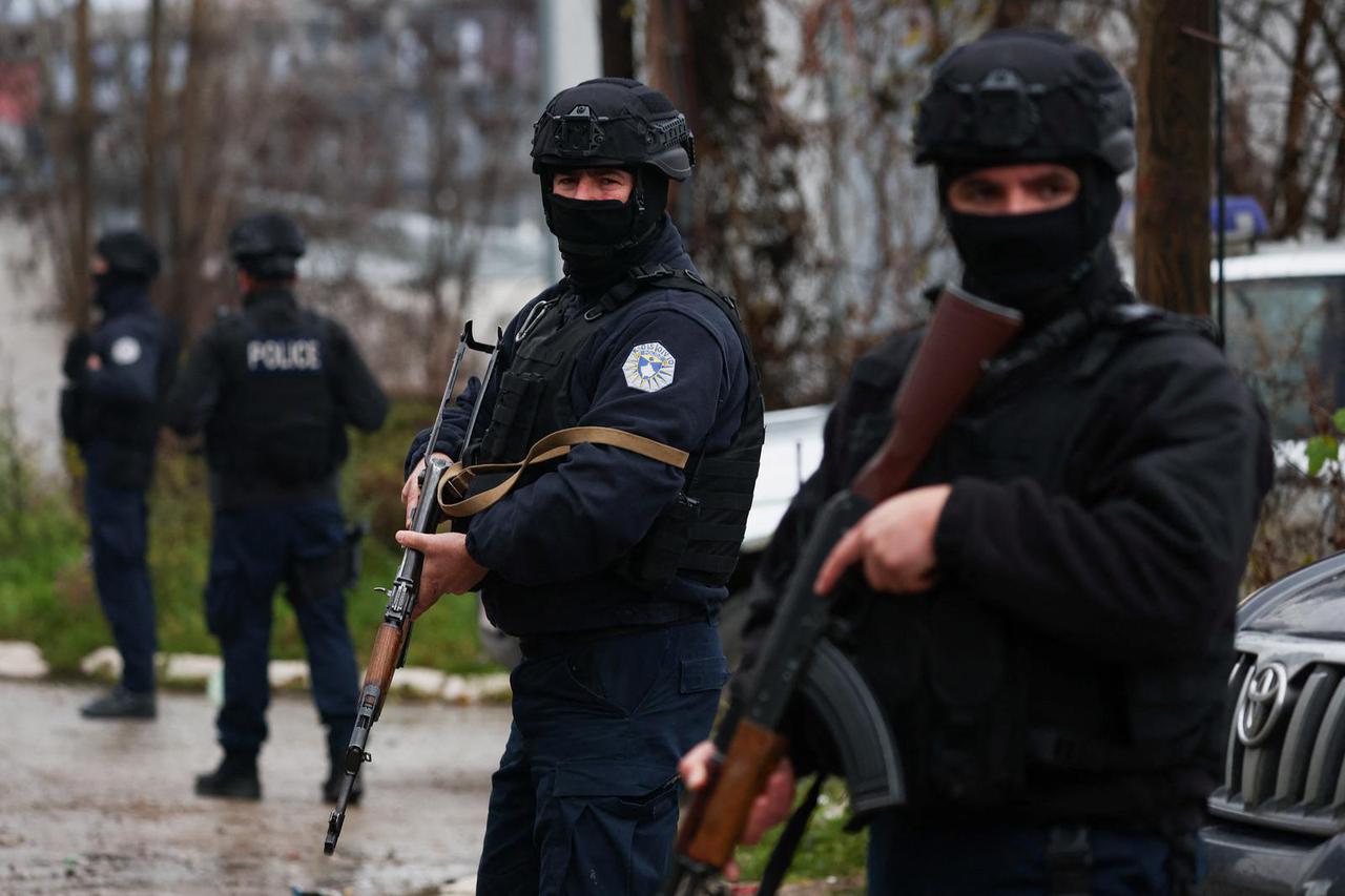 Kosovo police officers patrol an area in the northern part of the ethnically-divided town of Mitrovica