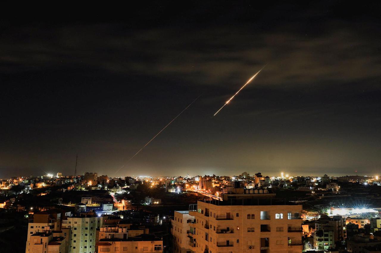 Iranian missiles fly towards Israel, as seen from Hebron