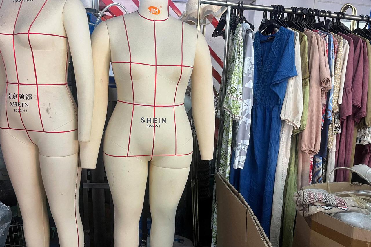 FILE PHOTO: Mannequins with logos of Shein are pictured at a clothing factory in Guangzhou