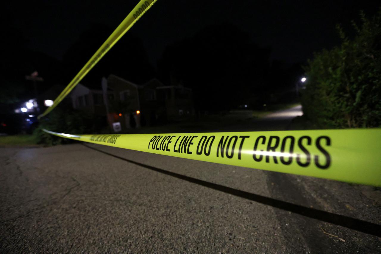 Law enforcement members guard the perimeter of the home of Republican presidential candidate and former U.S. President Donald Trump's shooting suspect