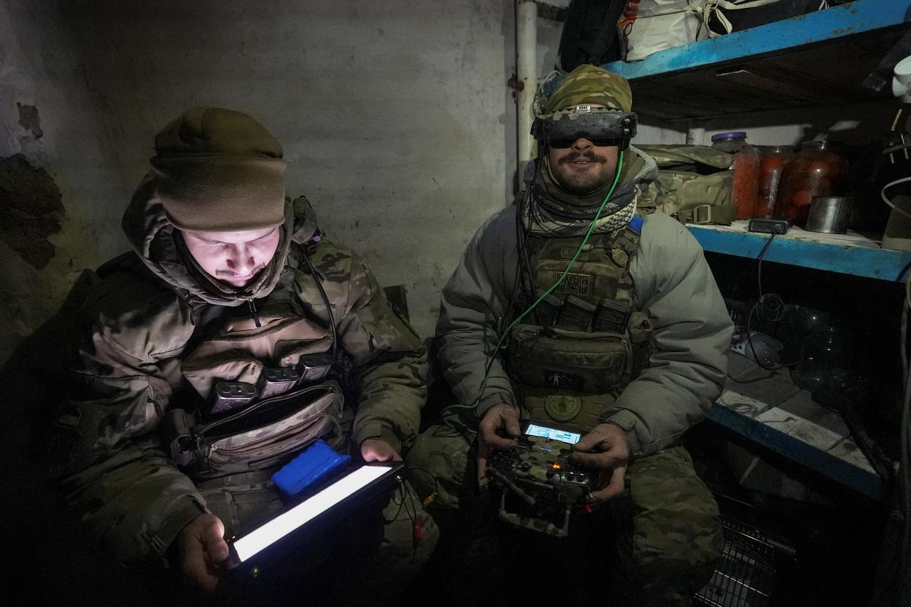 Ukrainian servicemen operate a first person view (FPV) drone at a position near the town of Horlivka