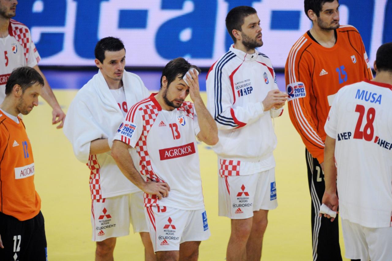 'Croatia\'s players react after loosing the men\'s EHF Euro 2012 Handball Championship semifinal match Serbia vs Croatia on January 27, 2012 at the Beogradska Arena in Belgrade. Serbia won 26 - 22.   