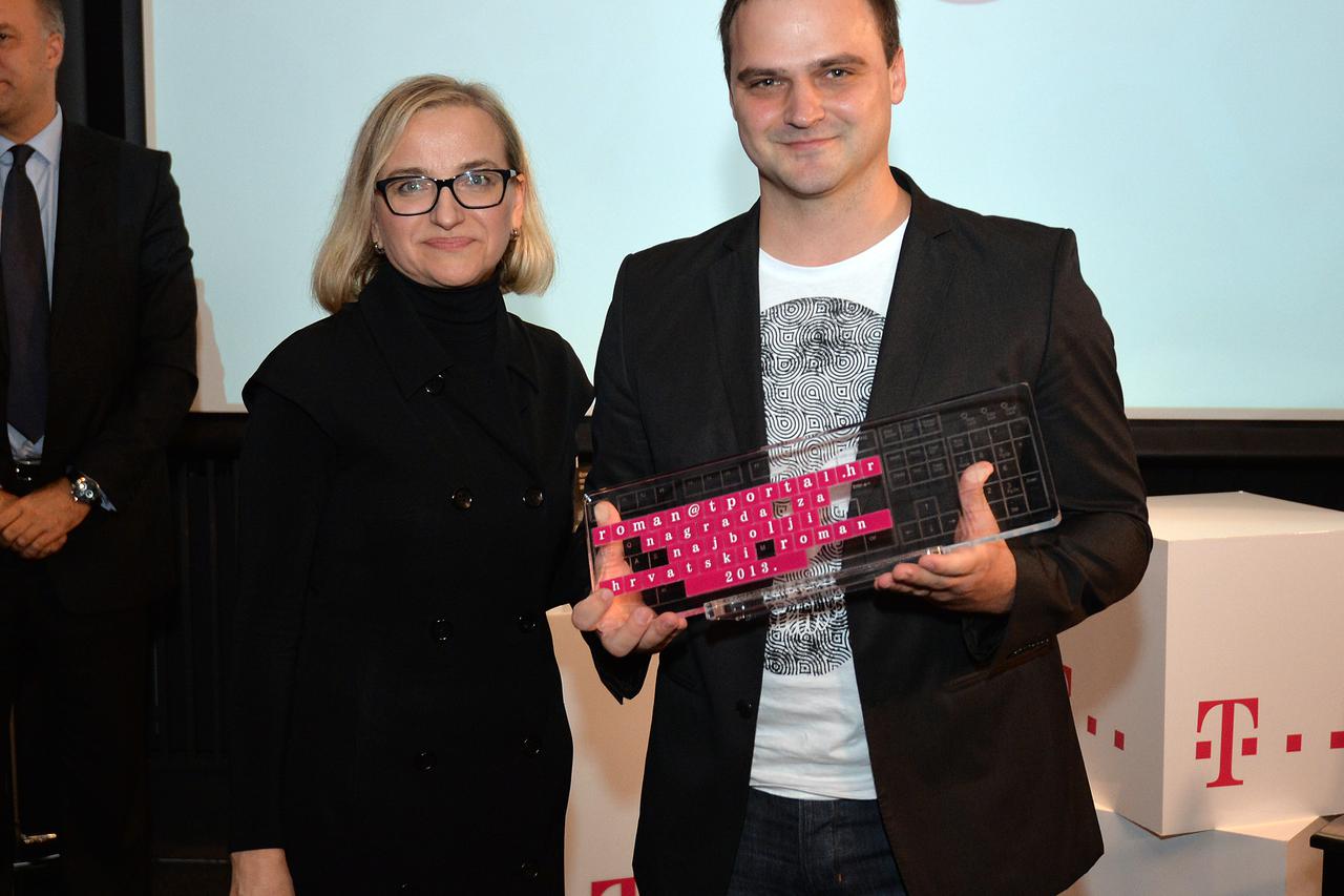 29.10.2014..,Zagreb -  Na svecanom proglasenju dobitnika tportalove knjizevne nagrade roman@tportal.hr u Dvorani Muller kina Europa u Zagrebu, Kristian Novak nagradjen je za svoj roman Crna mati zemla. Novak je za knjigu Crna mati zemla, uz odgovarajucu p