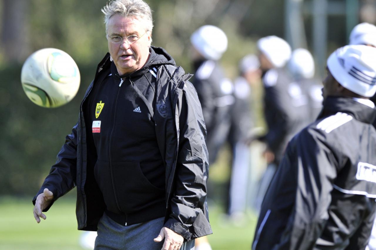 'Dutch football coaching  Guus Hiddink (L) stands during first training session with Anzhi Makhachkala\'s football team in Makhachkala on February 18, 2012. AFP PHOTO / SERGEI RASULOV JR.'