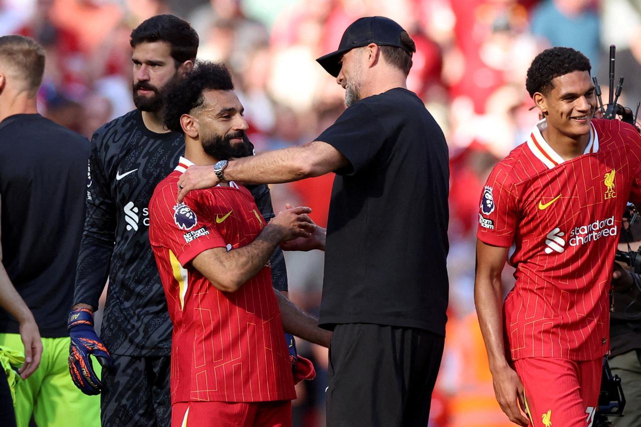 FILE PHOTO: Liverpool manager Juergen Klopp embraces Mohamed Salah
