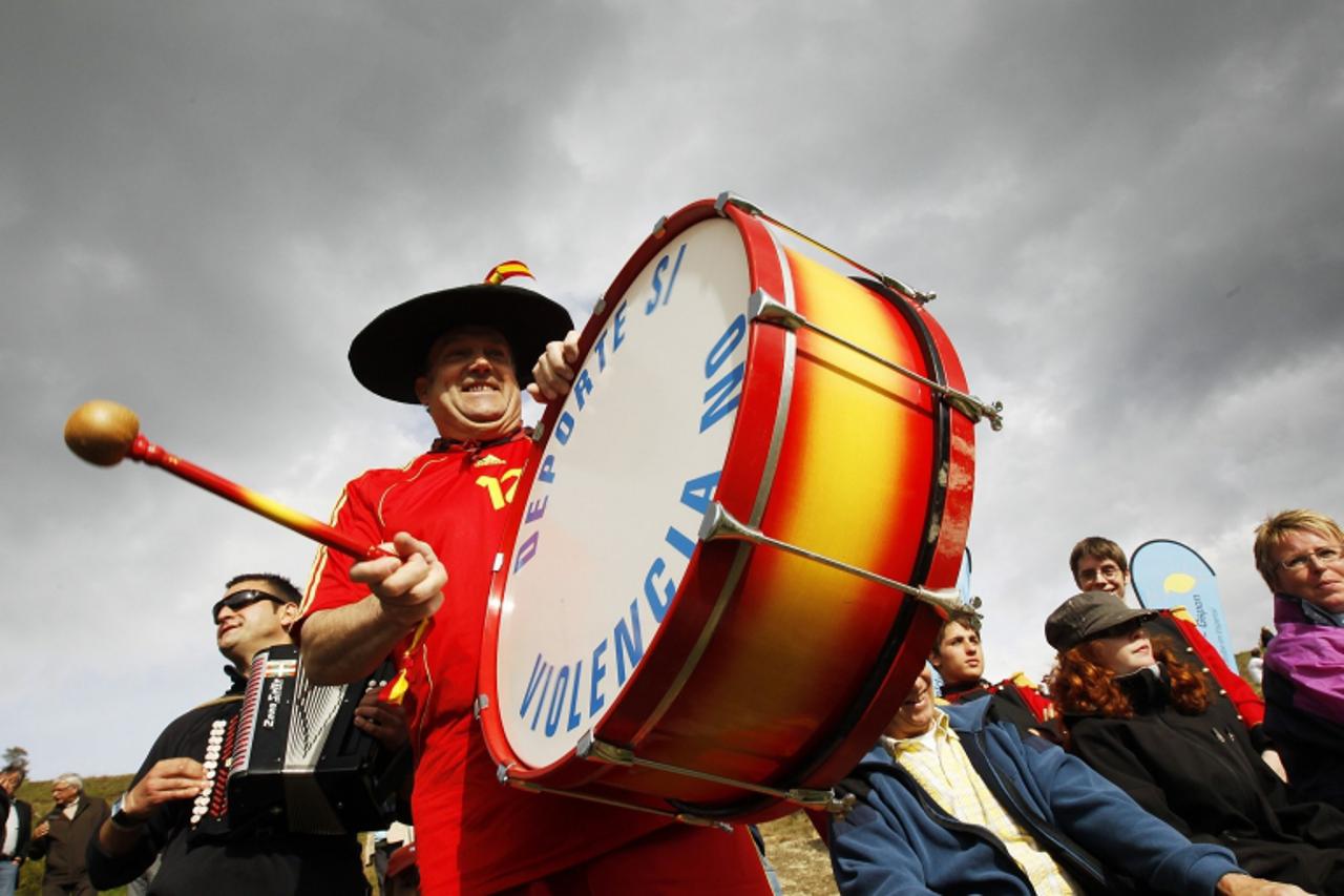 'Spanish soccer team supporter Manolo cheers as FC Gspon representing Switzerland plays against FC Zuma representing Spain during their Mountain Villages international soccer tournament match in Gspon